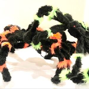 Furrry spiders - 4 total, 3 black and orange and 1  black and green.